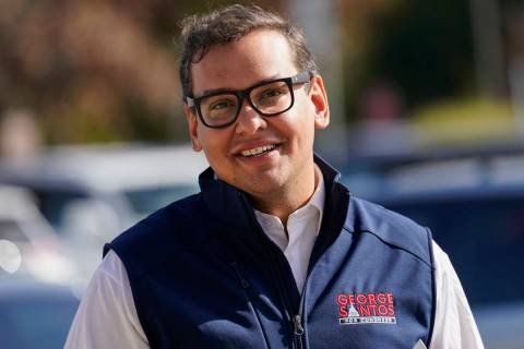 George Santos campaigns outside a Stop and Shop store, Nov. 5, 2022, in Glen Cove, N.Y. (AP Ph ...