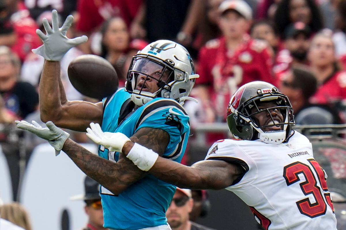 Carolina Panthers wide receiver DJ Moore catches a pass in front of Tampa Bay Buccaneers corner ...
