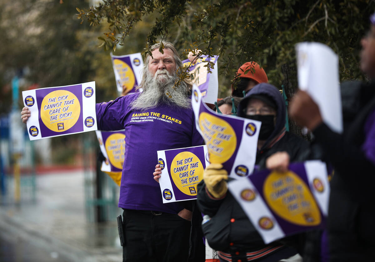 Dan Welch, whose wife is an SEIU Local 1107 member and nurse, participates in a picket in suppo ...