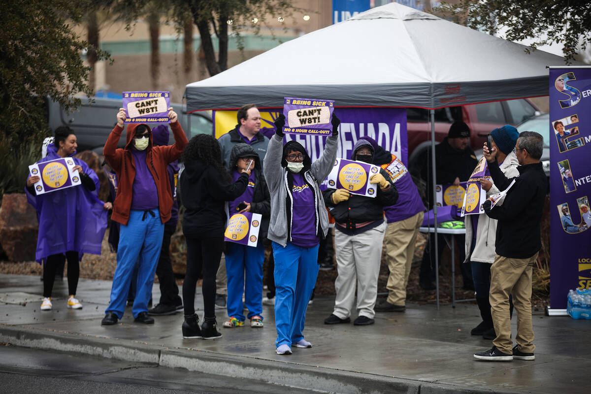 Members and staff of SEIU Local 1107 participate in a picket in support of health care workers ...