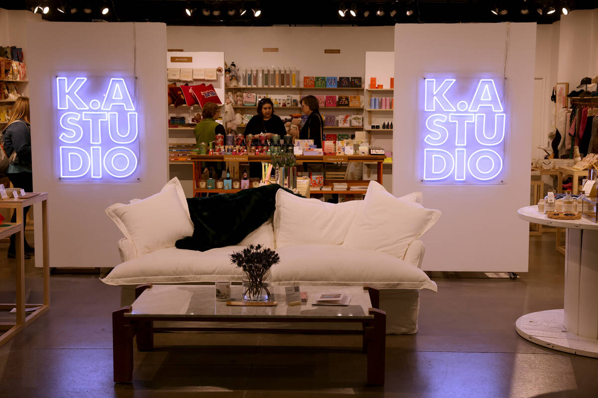 Conventioneers browse in the K.A Studio showroom during the biannual Las Vegas Market home furn ...