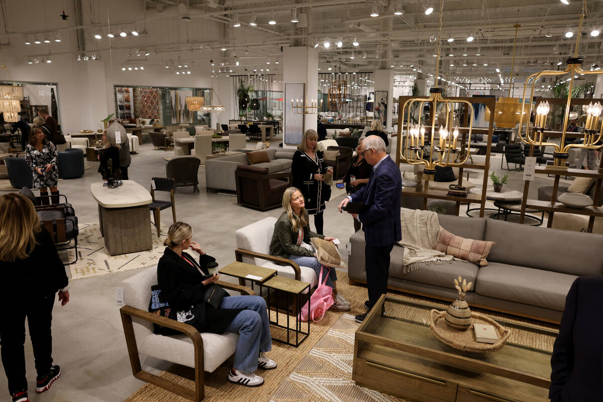 Conventioneers browse in the Classic Home showroom during the biannual Las Vegas Market home fu ...