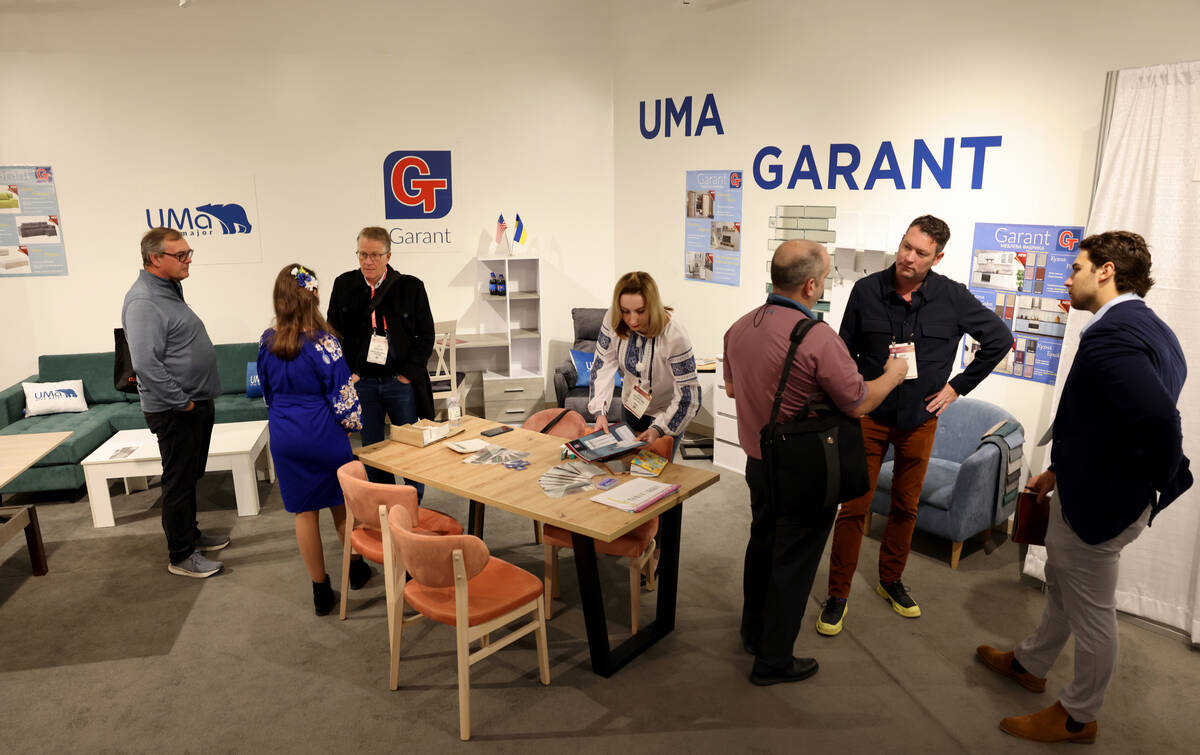 Conventioneers mingle in the UMA and Garant showrooms in the Ukrainian Pavilion during the bian ...