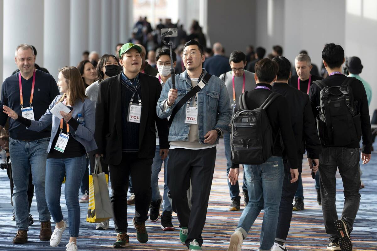 Attendees travel between halls during the CES tech show at the Las Vegas Convention Center on S ...
