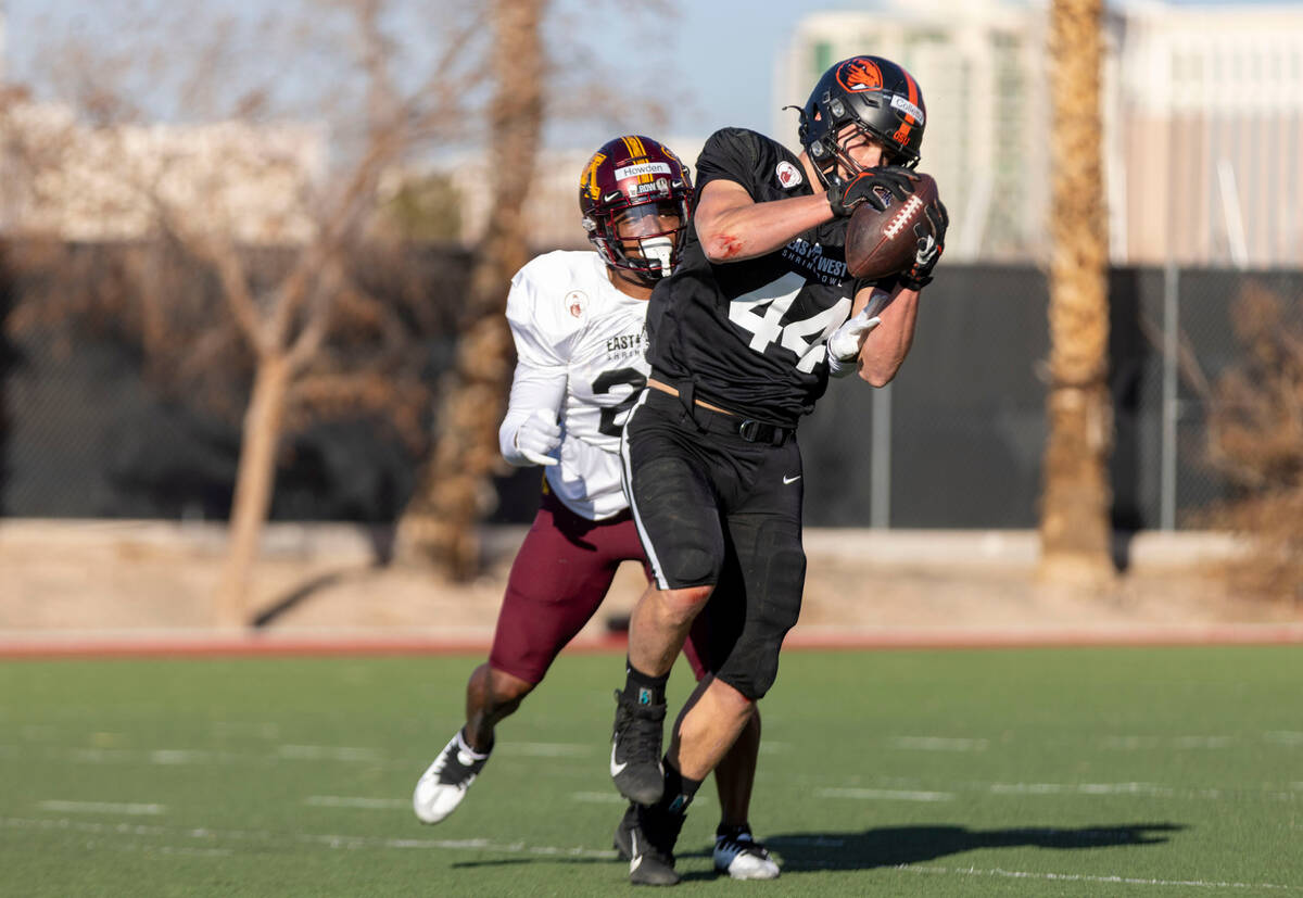 West fullback Jack Colletto (44) makes a catch with West safety Jordan Howden (28) in coverage ...