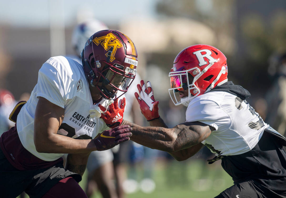 West safety Jordan Howden (28) works against West safety Christian Izien (30) during practice f ...