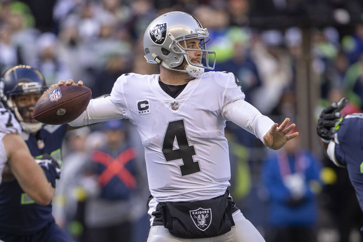 Raiders quarterback Derek Carr (4) prepares to throw during the first half of an NFL game again ...