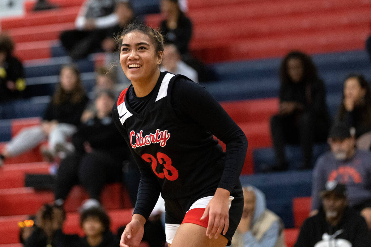 Liberty’s Adrienne Puletasi (23) smiles after scoring a three-pointer against Clark duri ...