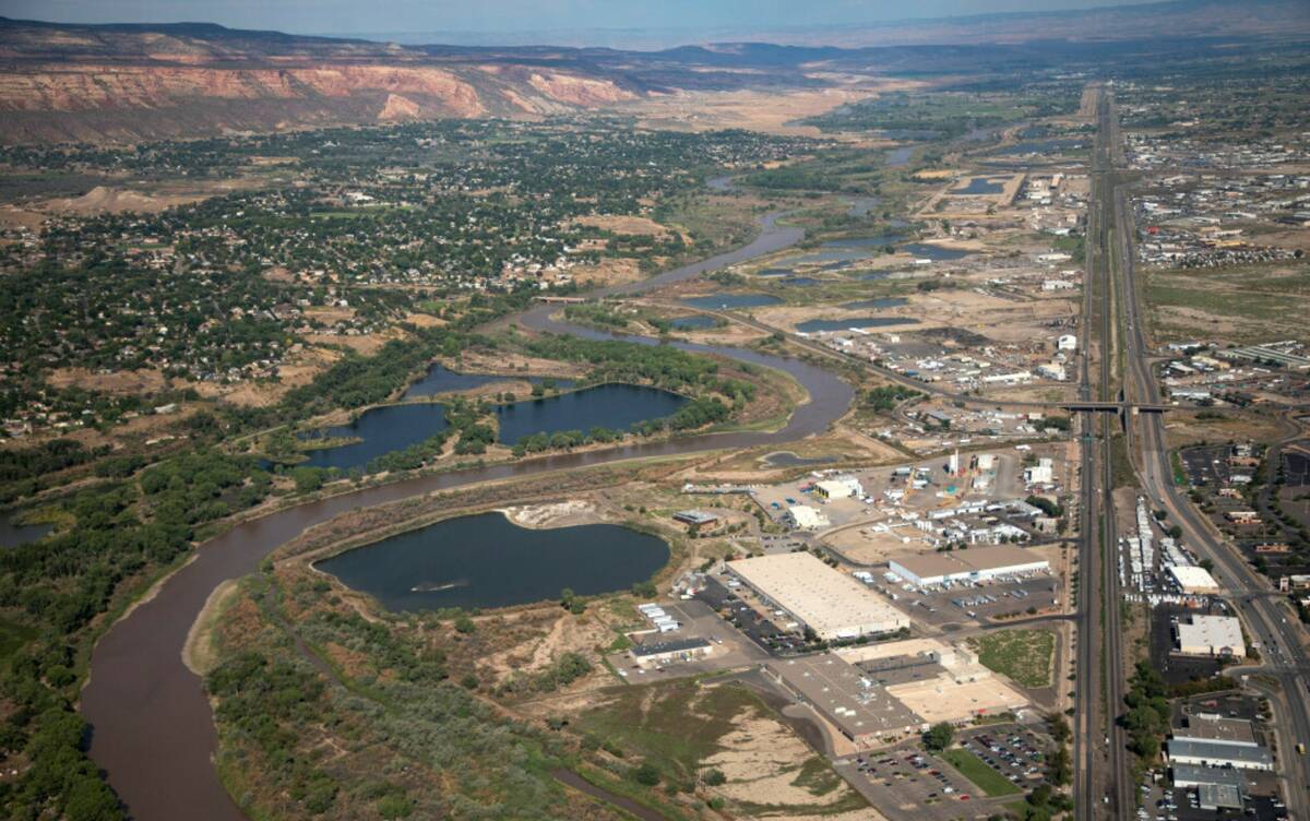 The Colorado River passes through Grand Junction, Aug. 24, 2022, in Mesa County, Colo. (Hugh Ca ...