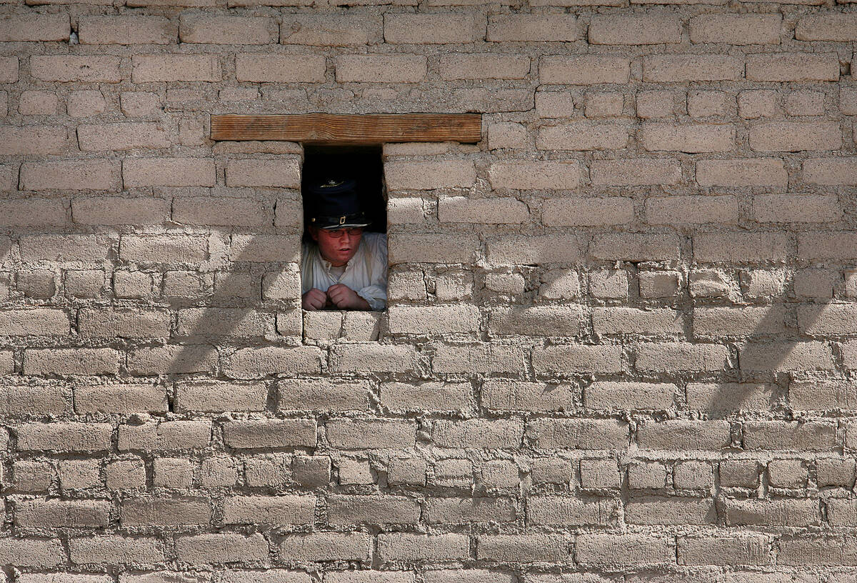 RJ-LIVING--Niall (cq) St. John, 15, looks out one of the windows of the Old Mormon Fort at the ...