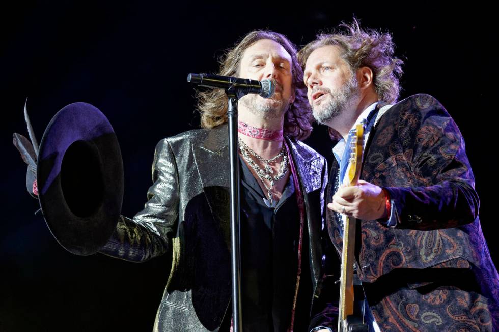 Chris Robinson, left, and Rich Robinson of The Black Crowes perform at Ravinia on Tuesday, July ...