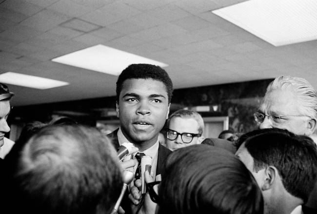 Muhammad Ali speaks to newsmen after he posted bond on a Federal Grand Jury indictment on a cha ...