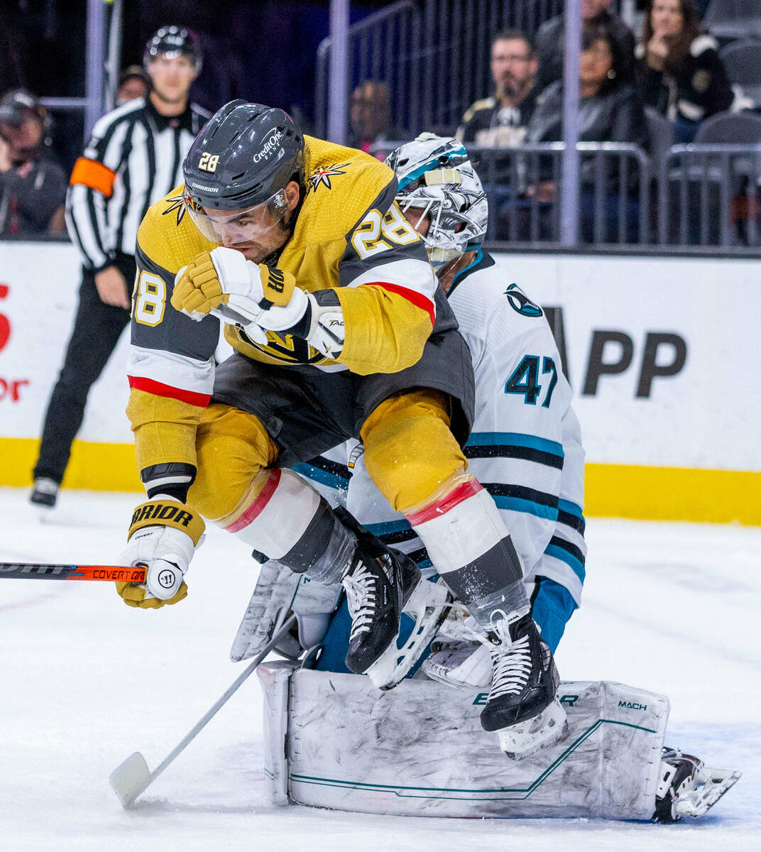 Golden Knights left wing William Carrier (28) leaps to avoid a shot on goal as San Jose Sharks ...