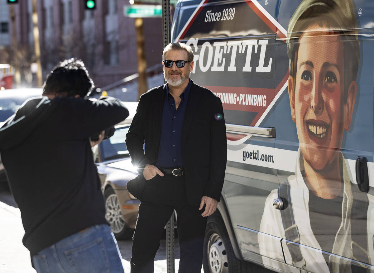 Ken Goodrich, CEO of Goettl, poses for a photo in front of his company's van during a promotion ...