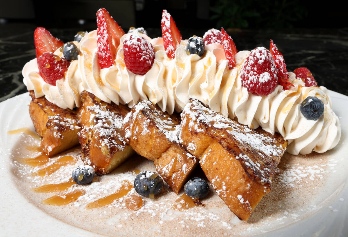 French Toast with berries, fresh caramel and Chantilly cream at Zenaida's Cafe on East Tropican ...