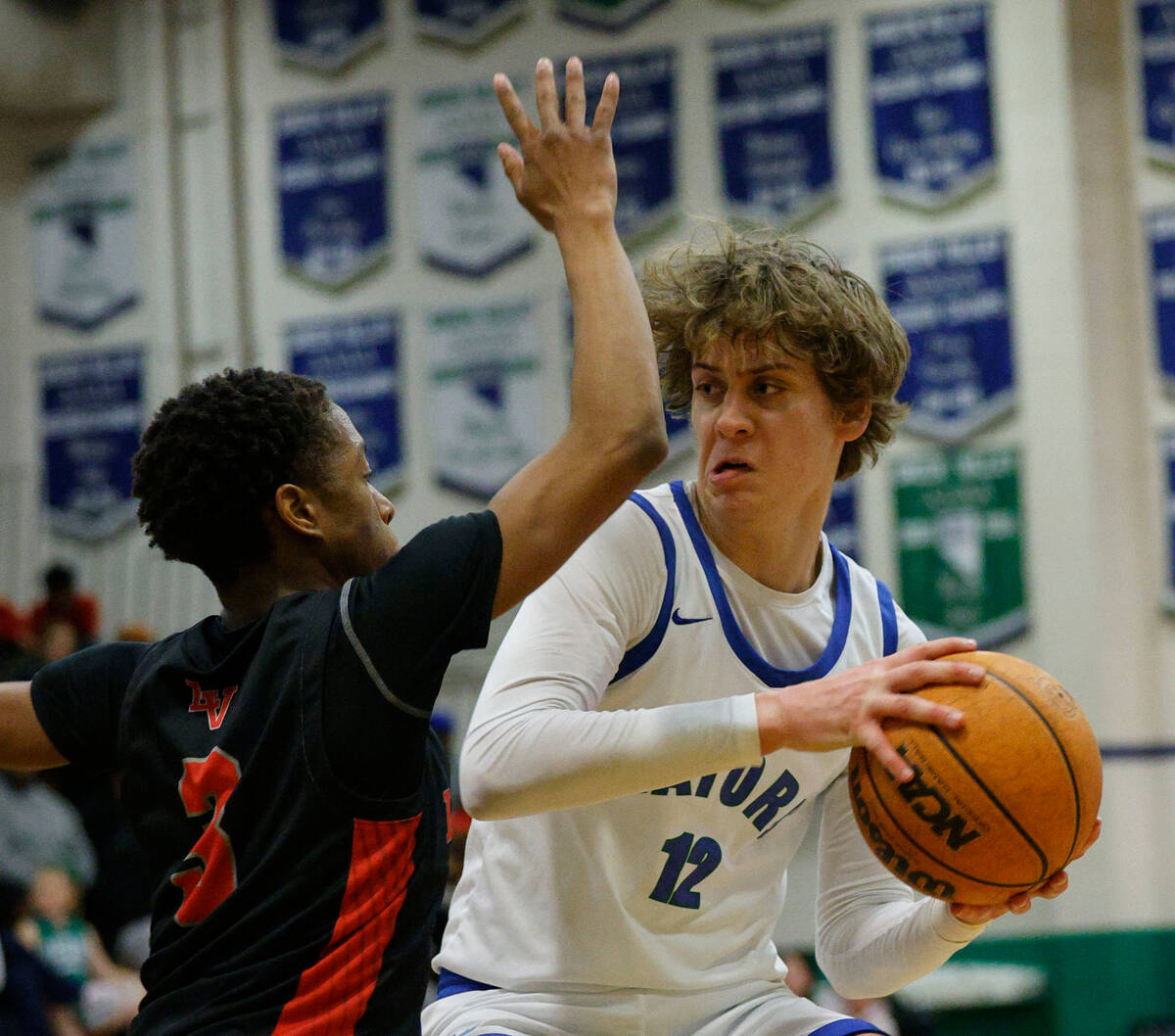 Green Valley's Brock Barney (12) looks to pass against Las Vegas' Tayshaun Jackson (3) during t ...