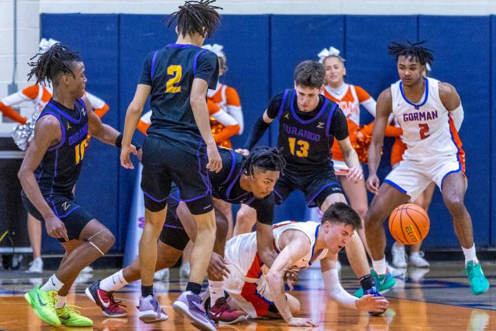 Bishop Gorman guard Ryder Elisaldez (24) loses the ball after a strip from Durango guard Taj De ...