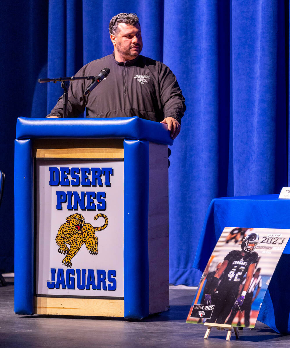 Head football coach Tico Rodriguez looks to 6 of the Desert Pines High School football players ...