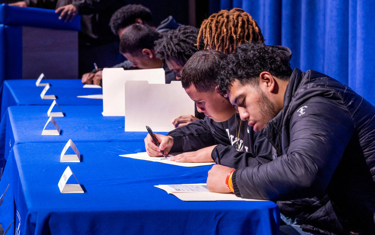 Six of the Desert Pines High School football players sign with college programs on Wednesday, F ...