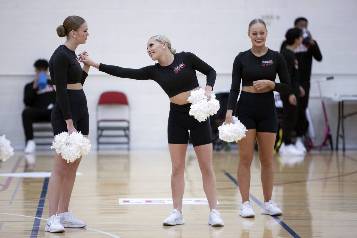 Fifth-year senior Alya Kretchman, center, hangs out with her teammates during the Rebel Girls & ...