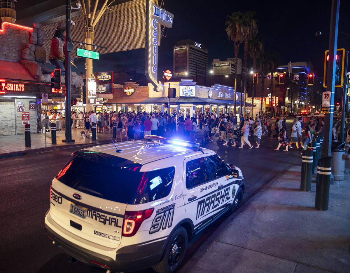 Deputies with the Las Vegas Marshals Office park outside the Fremont Street Experience on Satur ...
