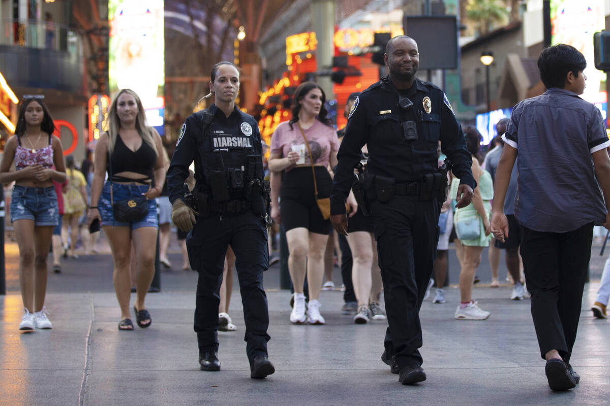 Deputies with the Las Vegas Marshals Office patrol the Fremont Street Experience on Saturday, J ...