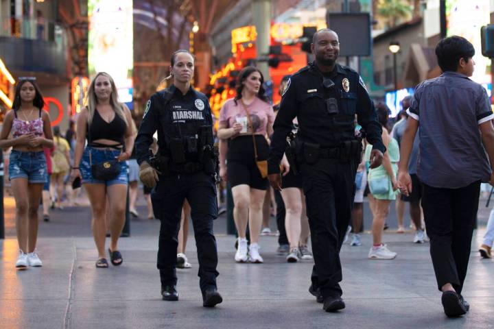 Deputies with the Las Vegas Marshals Office patrol the Fremont Street Experience on Saturday, J ...