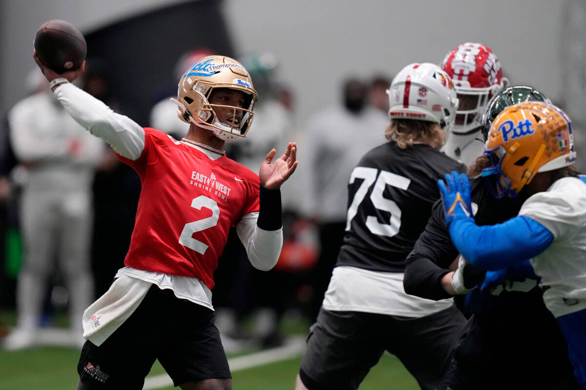 West quarterback Dorian Thompson-Robinson of UCLA throws during practice for the East West Shri ...