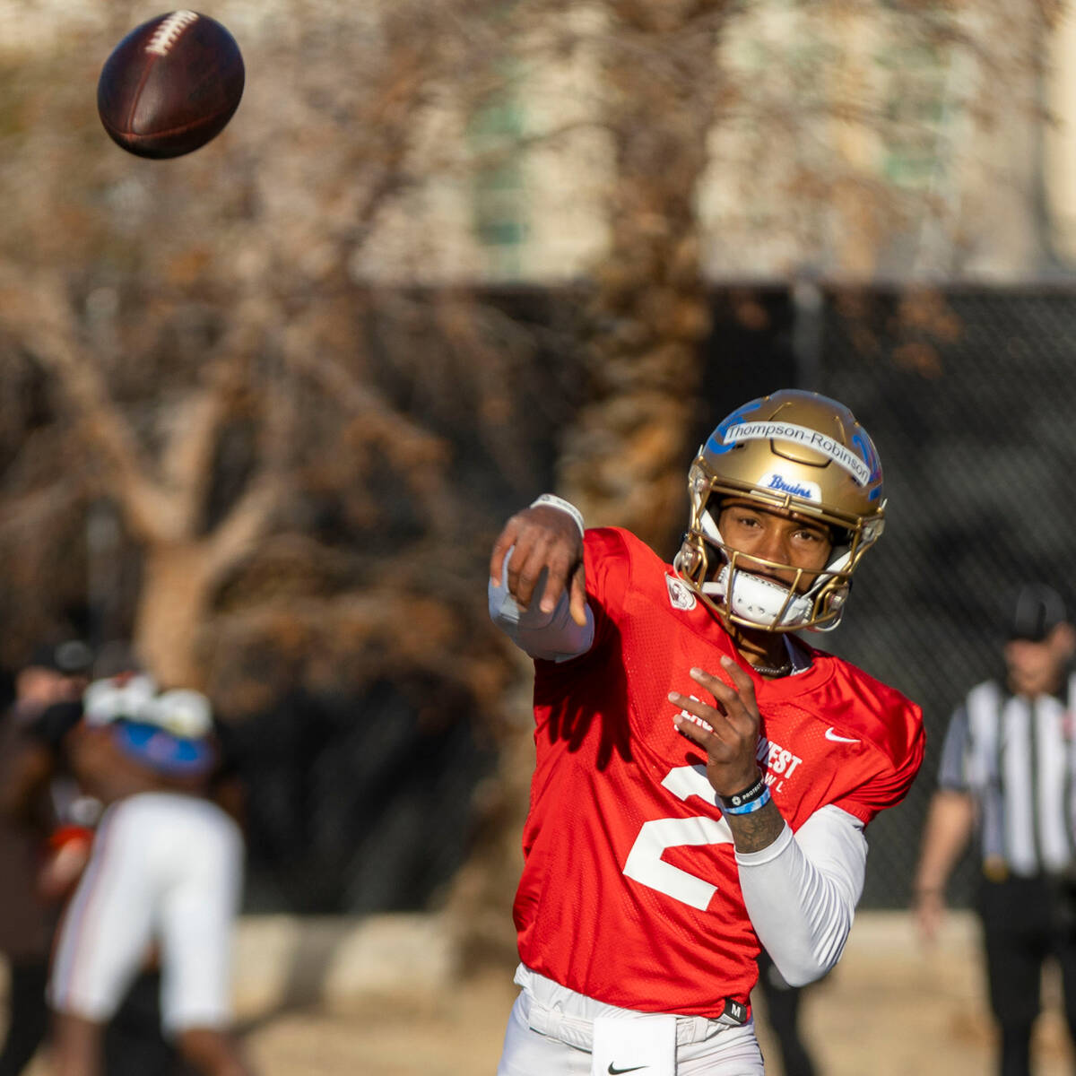 West quarterback Dorian Thompson-Robinson (2) throws the football during practice for the East ...