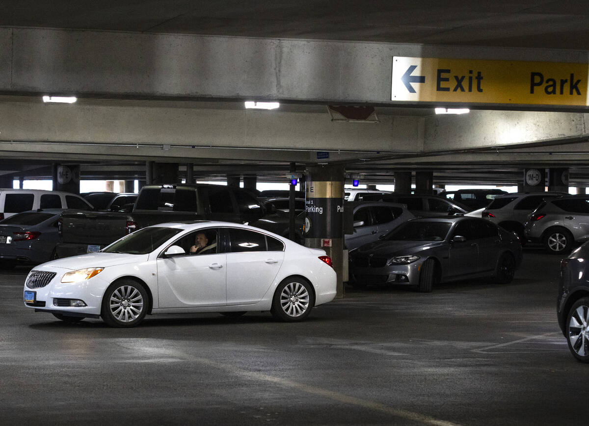 A passenger looks for a parking space at the level 2 of Terminal 1 parking lot at Harry Reid in ...