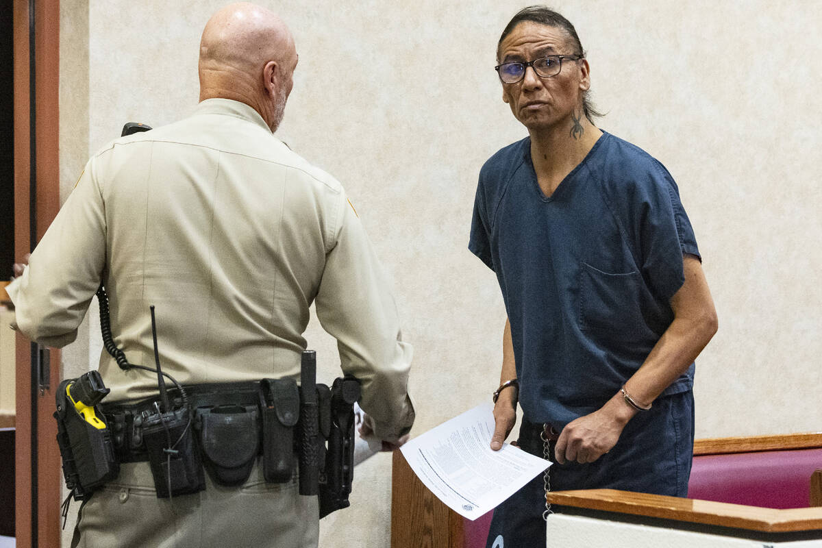 Nathan Chasing Horse, accused of sexually assaulting children for two decades, is led out of th ...