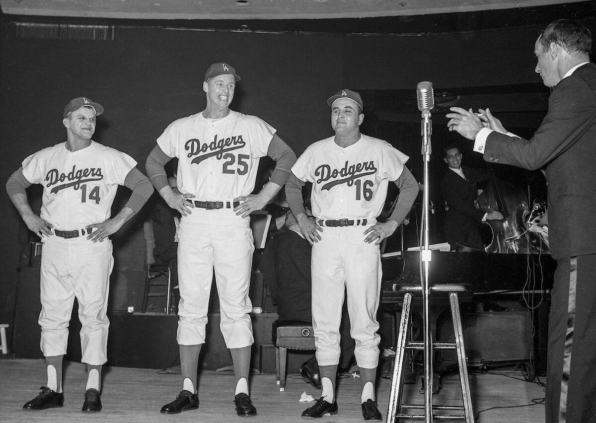 Joey Bishop directs Los Angeles Dodgers Bill Skowron (14), Frank Howard (25) and Ron Perranoski ...