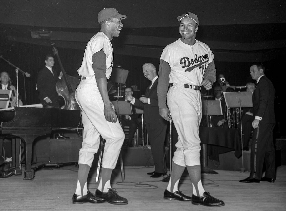 Los Angeles Dodgers Willie Davis (3) and Tommy Davis (12) perform with other Dodgers and Joey B ...