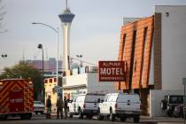 Las Vegas firefighters respond to the scene of a fire at the Alpine Apartment Motel that left 6 ...