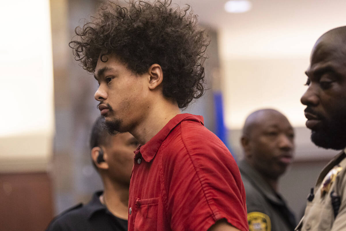 Tyson Hampton, charged in the fatal shooting of officer Truong Thai, appears in court at the Re ...