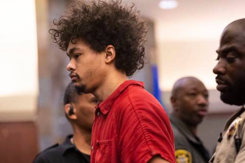 Tyson Hampton, charged in the fatal shooting of officer Truong Thai, appears in court at the Re ...