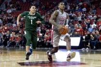 UNLV Rebels guard Luis Rodriguez (15) drives toward the hoop followed by Colorado State Rams gu ...