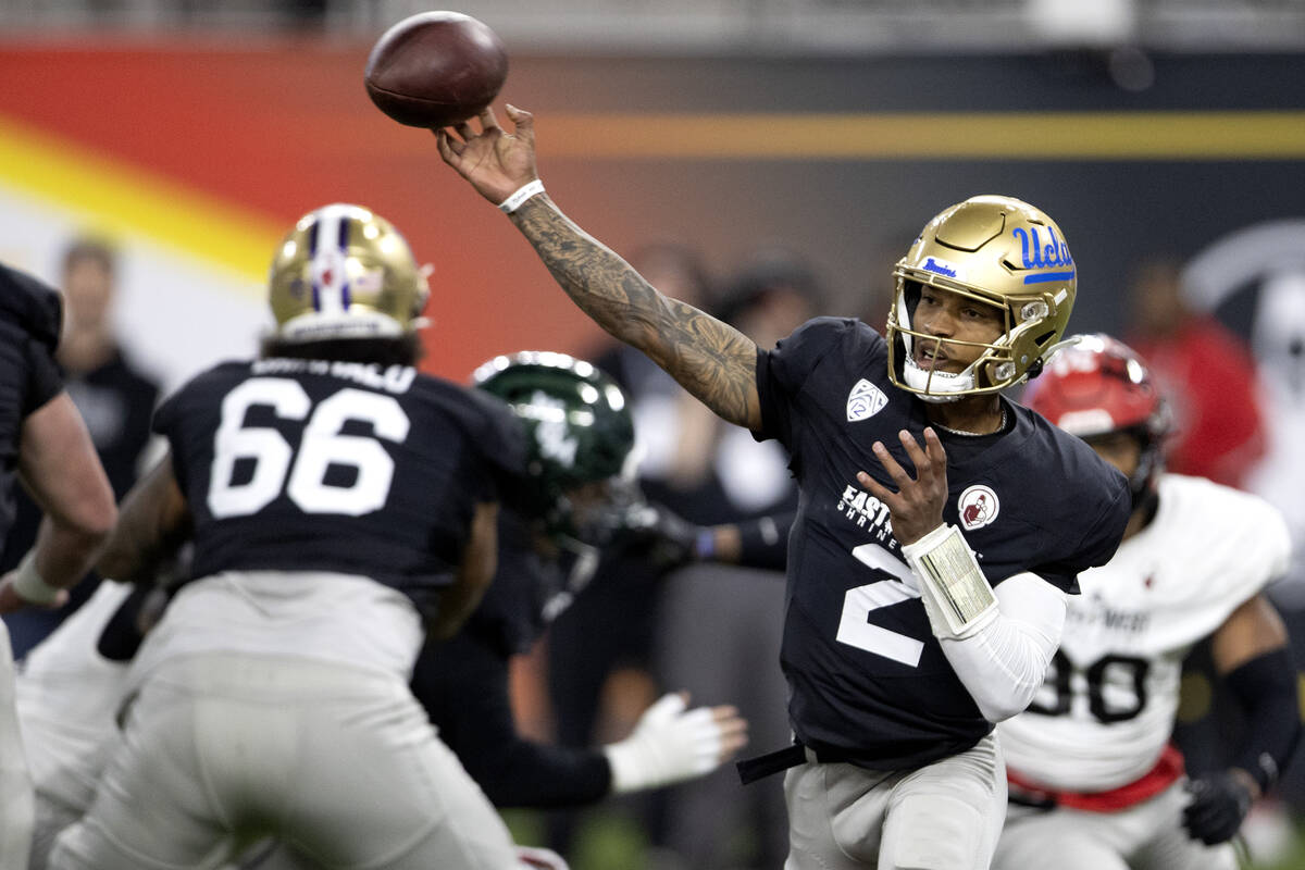 West quarterback Dorian Thompson-Robinson (2), of UCLA, passes during the first half of the Eas ...