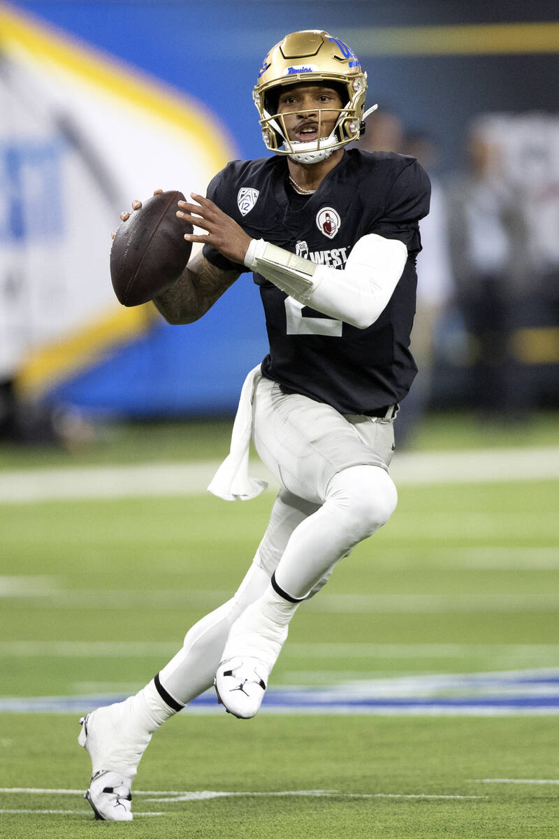 West quarterback Dorian Thompson-Robinson, who went to Bishop Gorman High School, prepares to p ...
