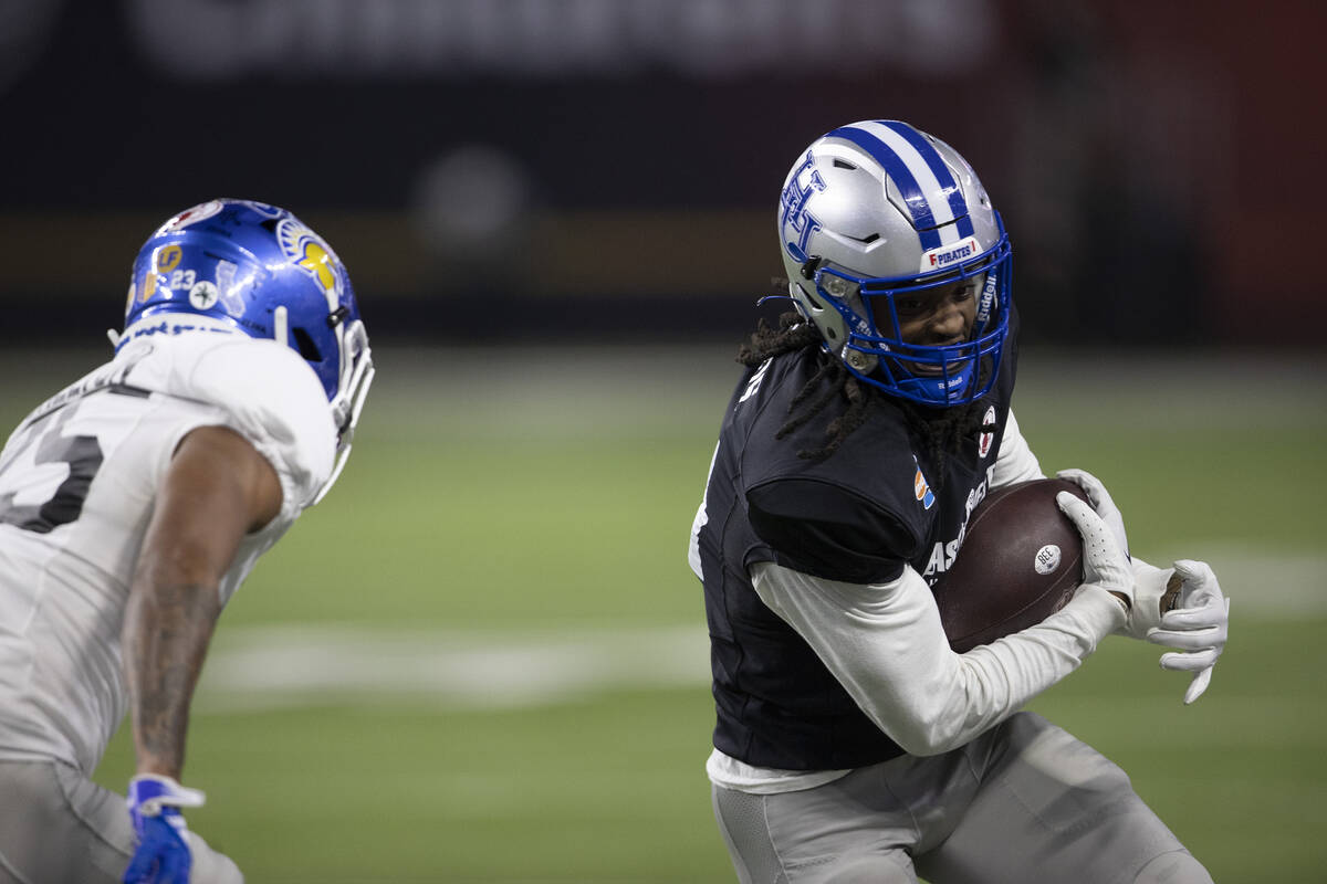 West wide receiver Jadakis Bonds of Hampton pivots after making a catch while East offensive li ...