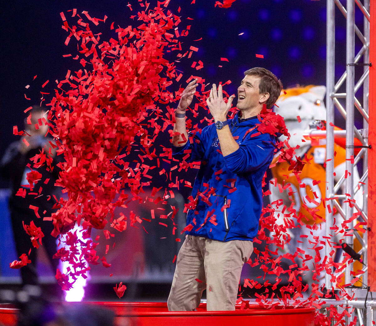The NFC's coach Eli Manning is dumped on with confetti after losing a target passing game in th ...