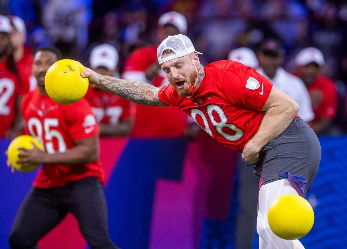 AFC teammates including the Max Crosby (98) of the Raiders is hit with a dodgeball during the 2 ...