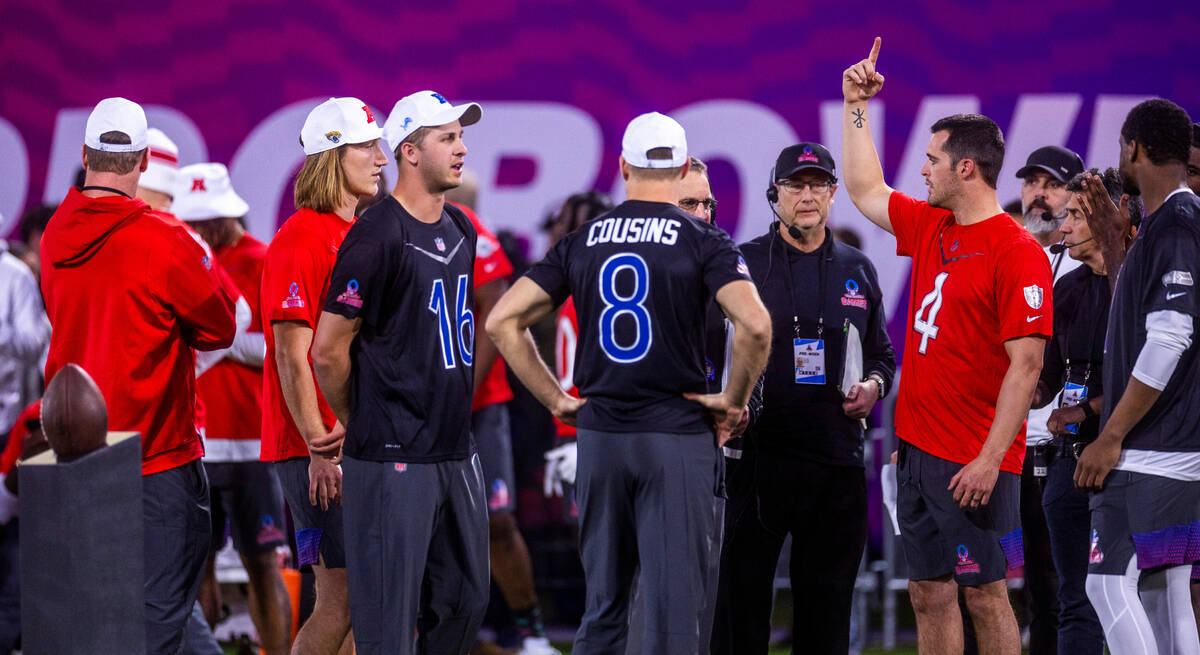 The AFC's Derek Carr (4, right) with the Raiders talks with other quarterbacks before a precisi ...