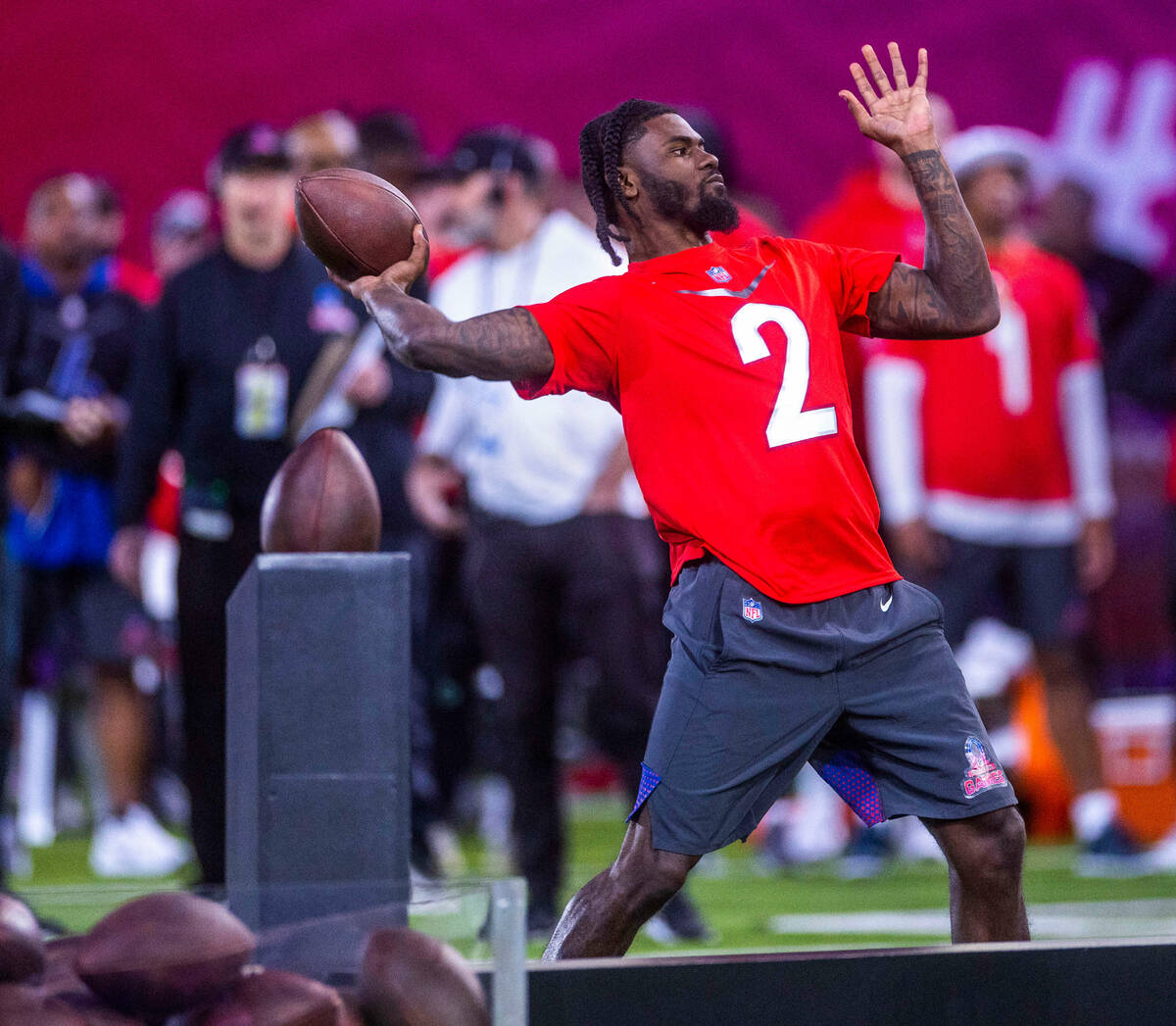 The AFC's Tyler Huntley (2) of the Ravens gets off a throw in a precision pass event during the ...