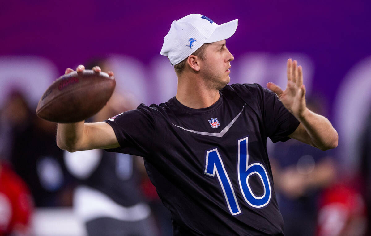 The NFC's Jared Goff (16) of the Lions eyes a target in a precision pass event during the 2023 ...