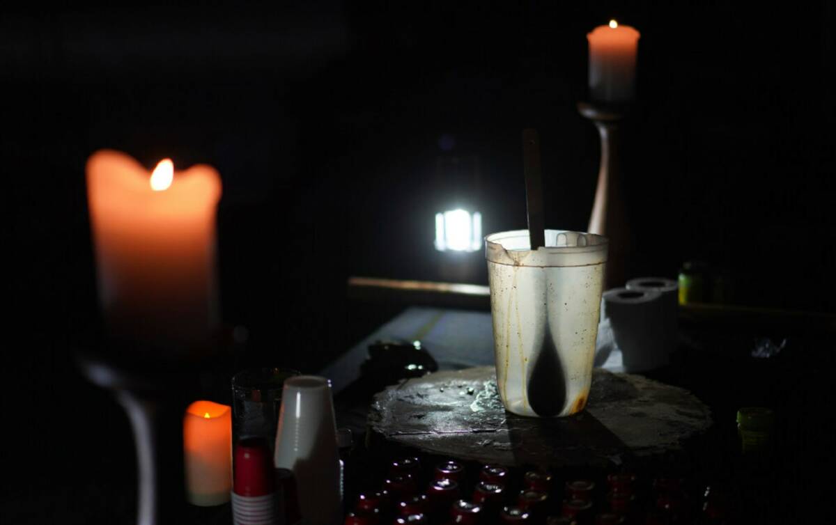 An empty pitcher and shot sized cups sit on an altar during an ayahuasca ceremony hosted by Hum ...
