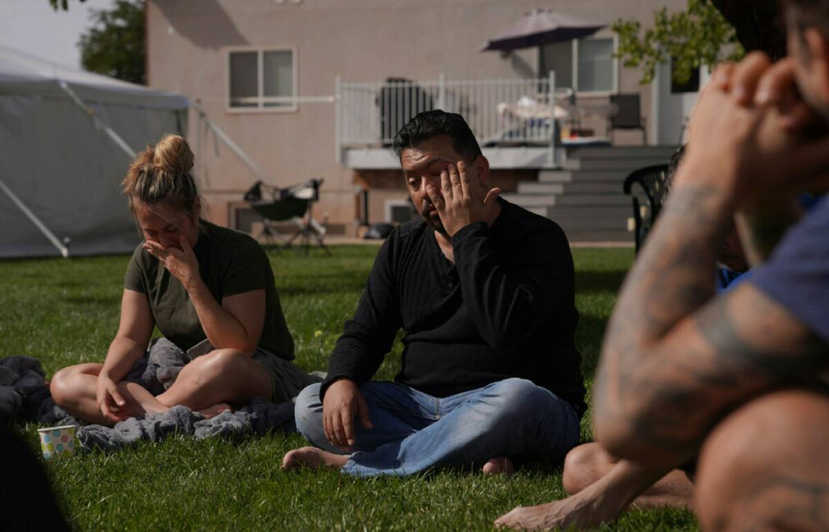 Lorenzo Gonzales, center, cries as he shares parts of his ayahuasca experience during an integr ...