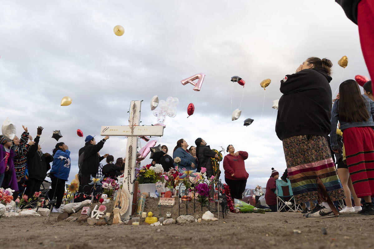 Loved ones of Anna Scott, a member of the Pyramid Lake Paiute Tribe, release balloons next to h ...