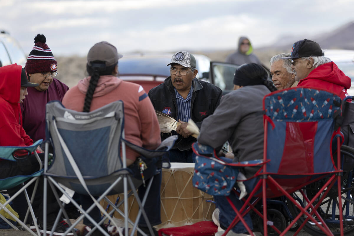 Terry Wright, center, who operates the local sweat lodge, participates in a drum circle for Ann ...