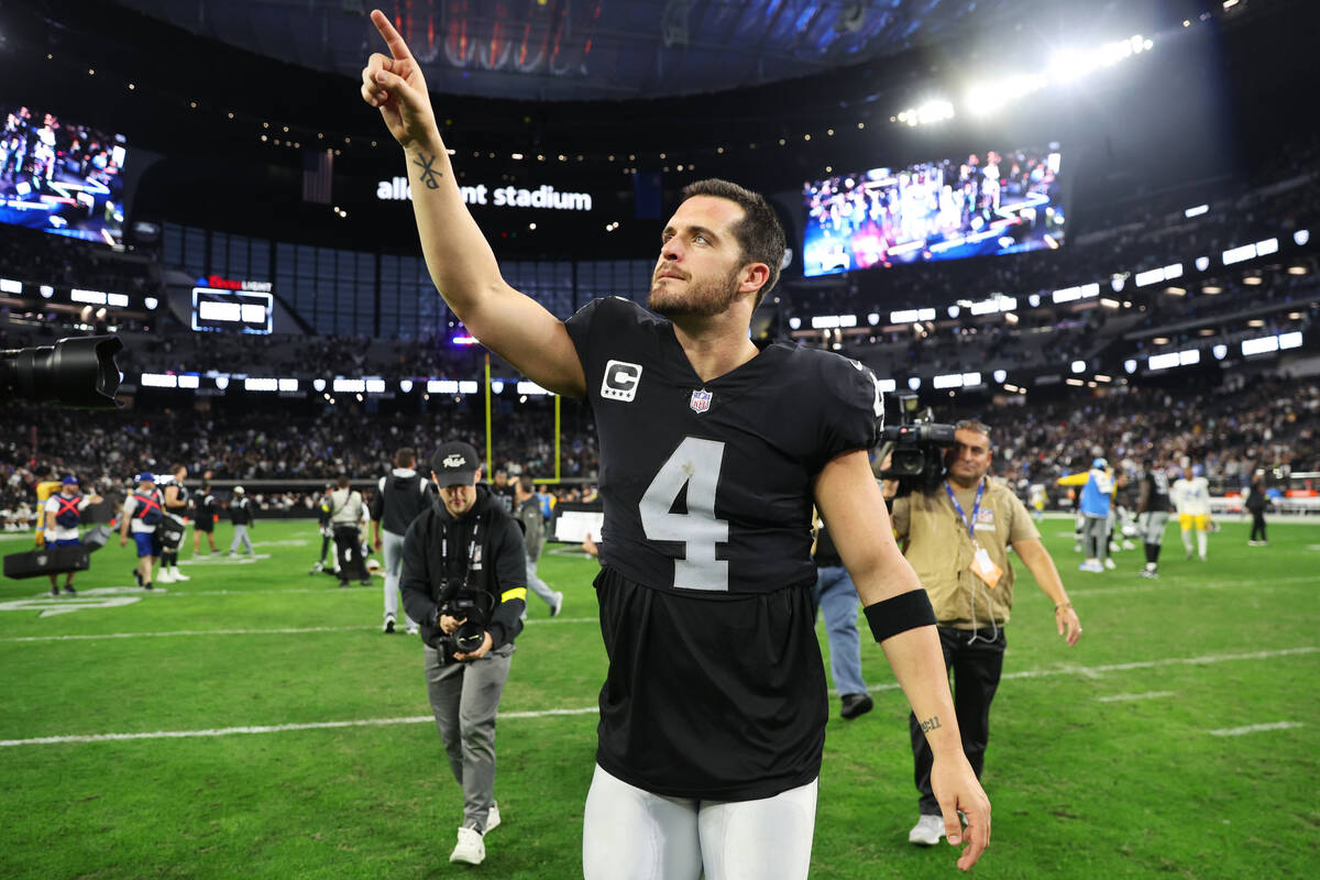 Raiders quarterback Derek Carr (4) walks the field following a 27-20 win against the Los Angel ...